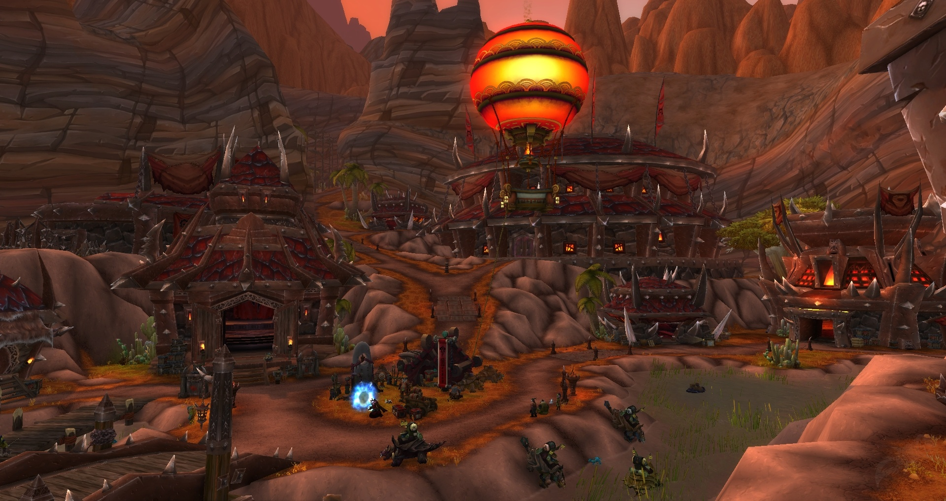 Screenshot of the city of Orgrimmar. Lots of iron pointy buildings on a red sand terrain.